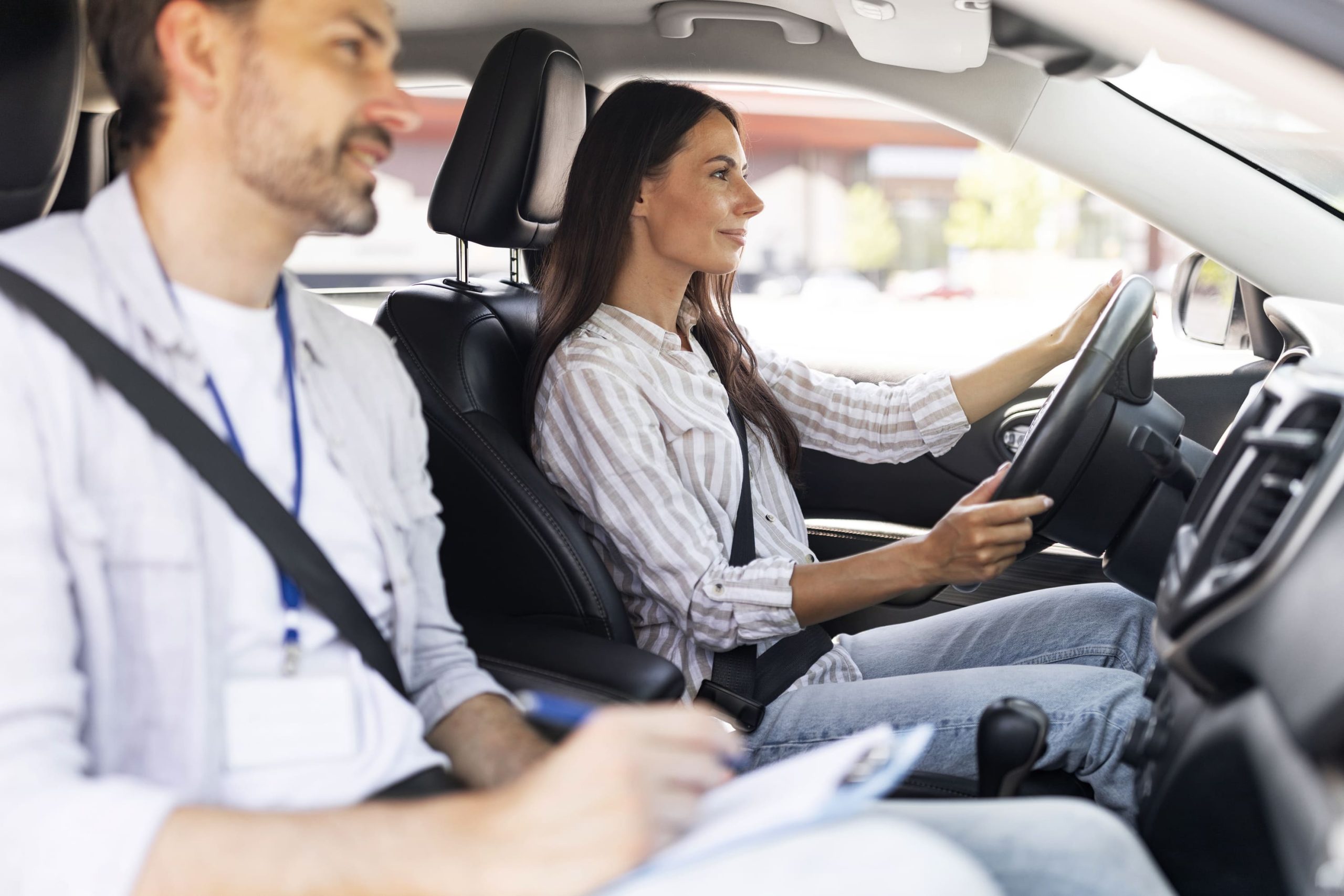 confident-young-lady-passing-exams-at-driving-scho-2023-11-27-05-03-14-utc-1-1-scaled