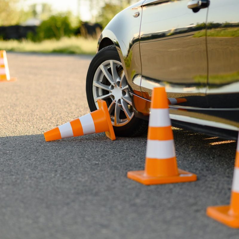 car-and-downed-cone-driving-school-concept-2023-11-27-05-29-20-utc (1) (1)